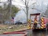 A fire in a garage that burned a vehicle and extended to a home and brush was reported in Barnstead on April 18.