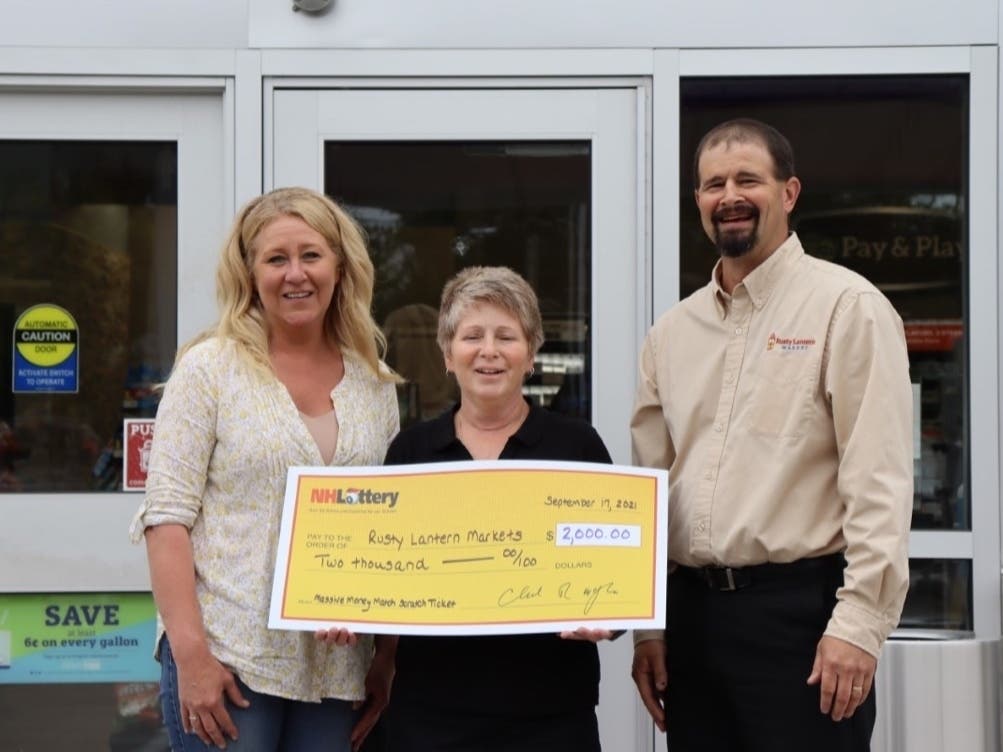 Julie O’Brien, New Hampshire Lottery sales representative, Lisa Gimis, Rusty Lantern Market store manager, and Kevin Colangelo, director of operations for Rusty Lantern Markets, pose for a photo at the Hudson store.