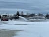 Off-duty Concord firefighters spray water on White Park Pond on Jan. 9 to both melt the snow and add icy layers in preparation for freezing and later, skating.