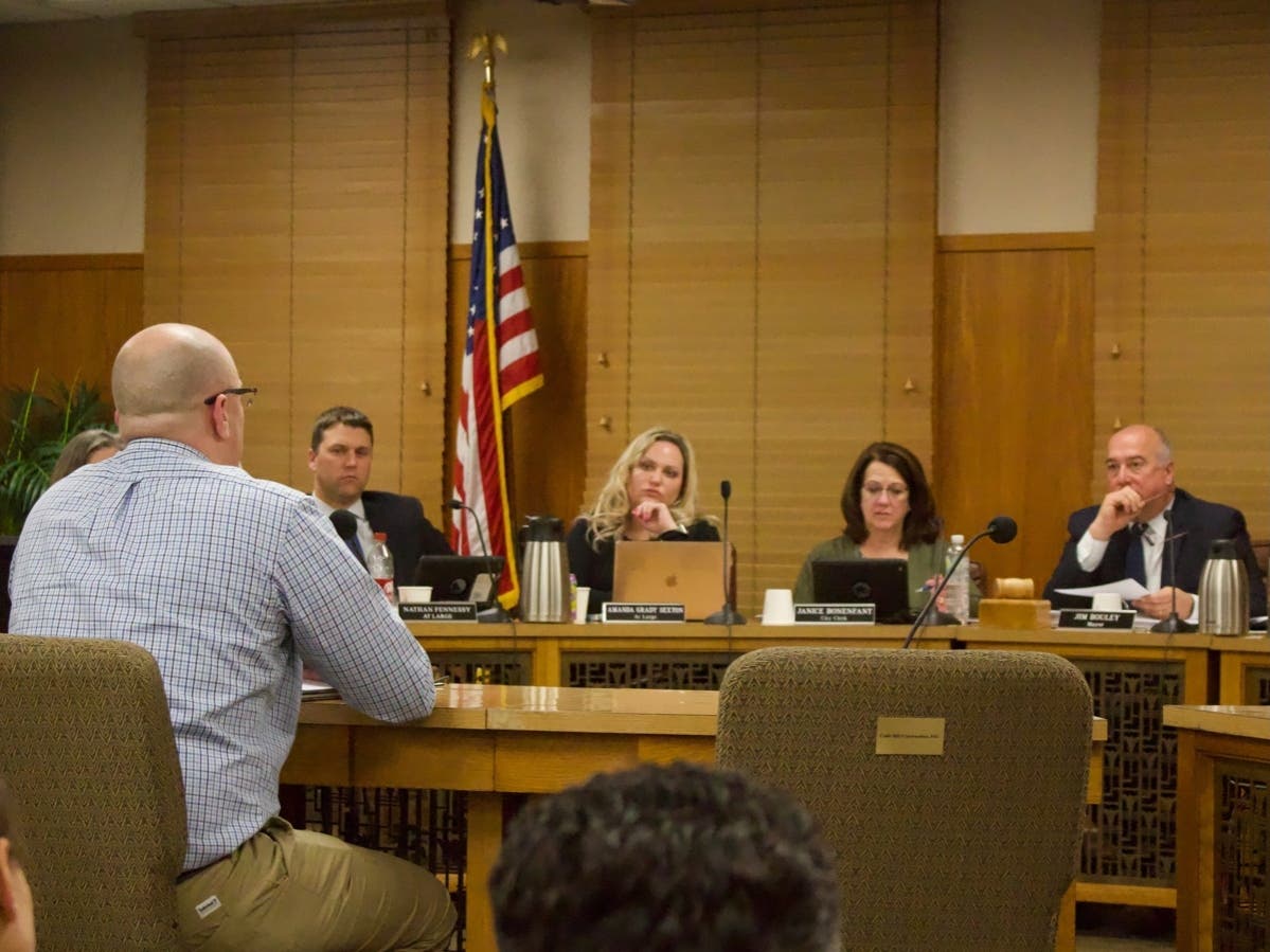 Concord’s mayor, city clerk, and two at-large city councilors listen to Jeff Lewis, a civil engineer, testify about an updated ethics ordinance that was ultimately tabled. 