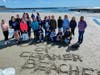 Hampton Academy students wrote that they "Dream of Cleaner Beaches" in the sand.