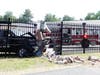 A pickup truck crashed into the National Guard fence near Pembroke Road in Concord on June 13. 