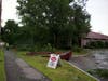 Trees were knocked down by a storm on July 12 causing damage to a sign and building at the Hood Plant on North State Street. 