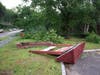 Trees were knocked down by a storm on July 12 causing damage to a sign and building at the Hood Plant on North State Street. 