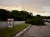 Trees were knocked down by a storm on July 12 causing damage to a sign and building at the Hood Plant on North State Street. 