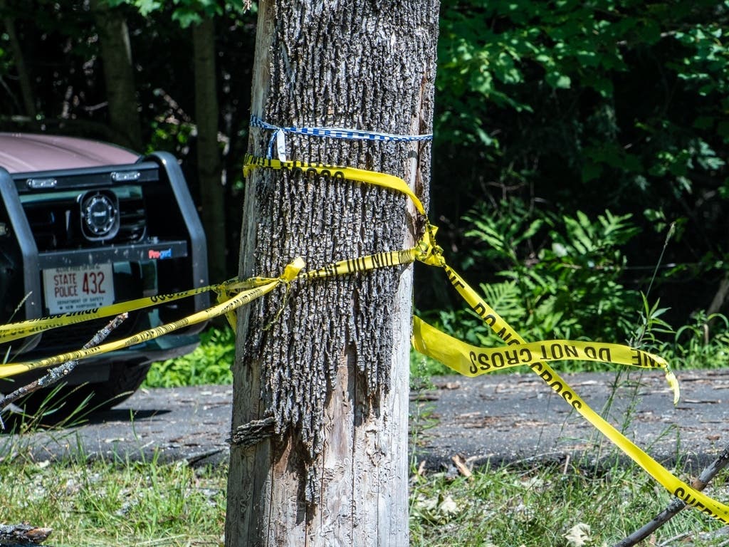  A New Hampshire State Police vehicle was parked outside a house on Wethersfield Drive in Northfield on Aug. 4 after a mother and two children were shot inside the home. 
