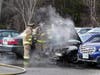 Bow firefighters extinguish a car fire on Dec. 18. 
