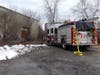 Concord firefighters extinguish a homeless campsite and B&M freight building fire on Jan. 18. Concord police are searching for an arson suspect. 