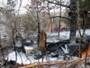 Concord firefighters extinguish a homeless campsite and B&M freight building fire on Jan. 18. Concord police are searching for an arson suspect. 
