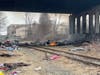 Concord firefighters extinguished a fire under the Interstate 393 bridge off South Commercial Street on April 11. 