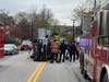 Concord fire and rescue teams assist in removing a driver after a pickup truck rolled on Franklin Street on May 3.