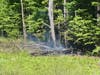 Concord and Webster firefighters battled a forest and brush fire in the city's northwest section on May 17.
