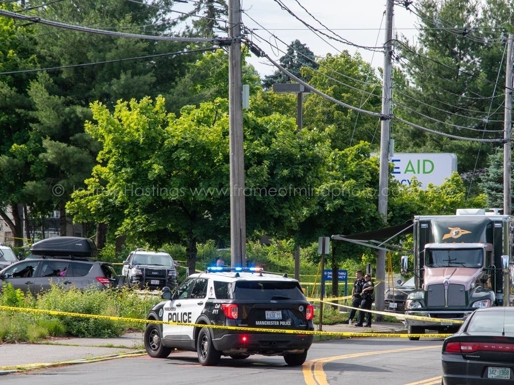Several shell casings were seen on the ground and a vehicle was heavily damaged from gunfire after state troopers and police used deadly force against Adnan Husejnovic outside the Rite Aid on Mammoth Road in Manchester in June 2022.