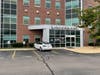 A driver crashed her Tesla into the side of the Concord Hospital Walk-In Care building on Commercial Street on July 21. 