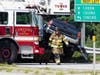 Concord police and fire and rescue teams deal with a crash on Route 106 at the Interstate 393 interchange on July 28. 