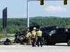 Concord police and fire and rescue teams deal with a crash on Route 106 at the Interstate 393 interchange on July 28. 