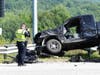 Concord police and fire and rescue teams deal with a crash on Route 106 at the Interstate 393 interchange on July 28. 