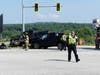 Concord police and fire and rescue teams deal with a crash on Route 106 at the Interstate 393 interchange on July 28. 