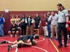 Bill Chavanelle, right, watches as Concord High School hosted a scrimmage between its wrestlers and others from Bow, Merrimack, and Winnisquam on Nov. 29. 
