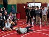 Coach Ham Munnell, right, watches as Concord High School hosted a scrimmage between its wrestlers and others from Bow, Merrimack, and Winnisquam on Nov. 29. 
