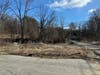 Prep work, including trash and debris clearance, is being performed on Black Hill Road, where a massive homeless camp has existed for years. The site is slated to be a mixed-use development.