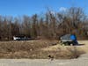 Prep work, including trash and debris clearance, is being performed on Black Hill Road, where a massive homeless camp has existed for years. The site is slated to be a mixed-use development.