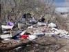 A hazmat team, possibly hired by the state of New Hampshire, has been cleaning up a massive homeless camp off Sexton Avenue for days.