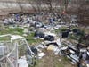A hazmat team, possibly hired by the state of New Hampshire, has been cleaning up a massive homeless camp off Sexton Avenue for days.