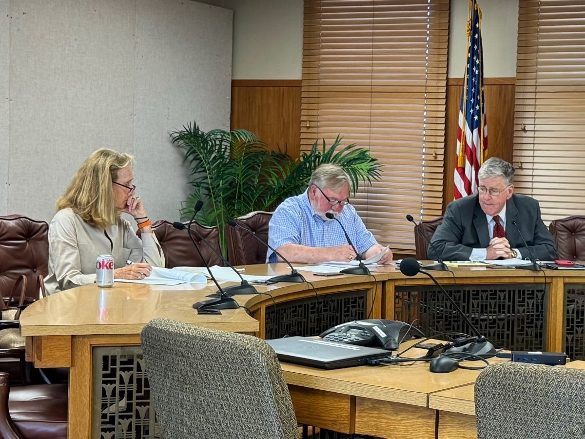 Marcia Moran, left, Steve Shurtleff, center, and John Sullivan, right, meet during a Board of Ethics Meeting on June 24. Tenley Callaghan and James Rosenberg attended remotely.
