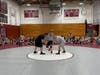 Nicholas “Tiny” Zeras and Chrigus Boezeman, former high school wrestlers, educators, and staffers at the Crimson Tide wrestling camp, faced off against each other on June 27.