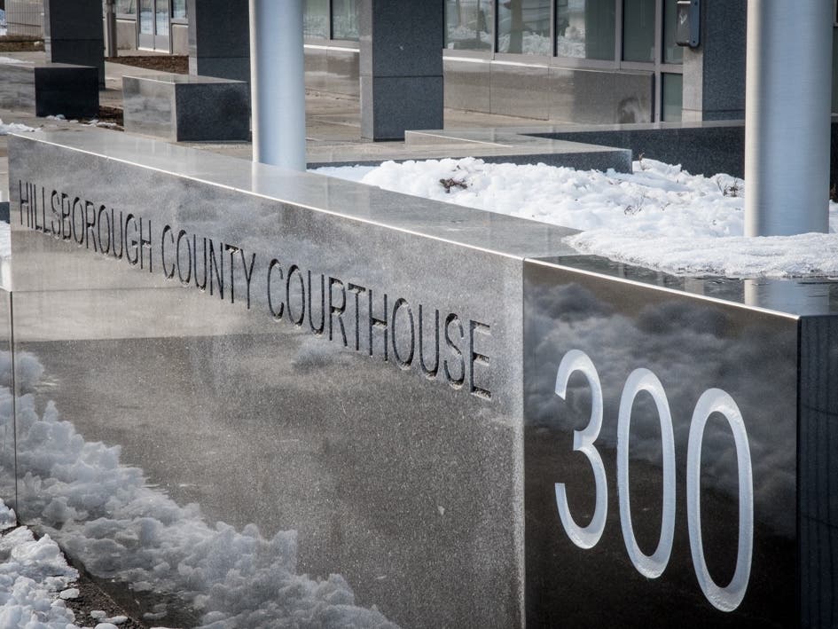 A felon from Manchester was indicted on weapon possession and drug dealing charges.