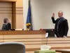 Concord Police Officer Richard Cobb, currently on unpaid leave, is sworn in by Judge Dan St. Hilaire in Merrimack County Superior Court on Jan. 9.