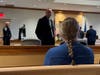 Concord Police Officer Richard Cobb, currently on unpaid administrative leave, looks at his wife in Merrimack County Superior Court on Jan. 10, awaiting the jury's verdict.