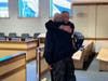 Concord Police Officer Richard Cobb receives a hug from a family member in Merrimack County Superior Court on Jan. 10 after a jury found him innocent on assault charges.