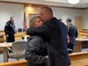 Concord Police Officer Richard Cobb, currently on unpaid administrative leave, embraces his weeping wife moments after a jury found him innocent of assault charges on Jan. 10.