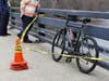 Police put yellow tape around a bicycle on Manchester Street.