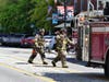 Smoke from the roof of a Downtown Concord building closed North Main Street temporarily on May 28.