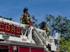 Smoke from the roof of a Downtown Concord building closed North Main Street temporarily on May 28.