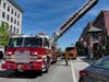 Smoke from the roof of a Downtown Concord building closed North Main Street temporarily on May 28.