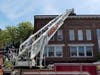 Smoke from the roof of a Downtown Concord building closed North Main Street temporarily on May 28.