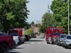 Smoke from the roof of a Downtown Concord building closed North Main Street temporarily on May 28.