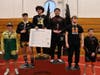 Winners in the 215-pound bracket, including Concord’s Isaiah Puckett, who placed second, at the 35th annual Capital City Classic Wrestling Tournament on Jan. 31.