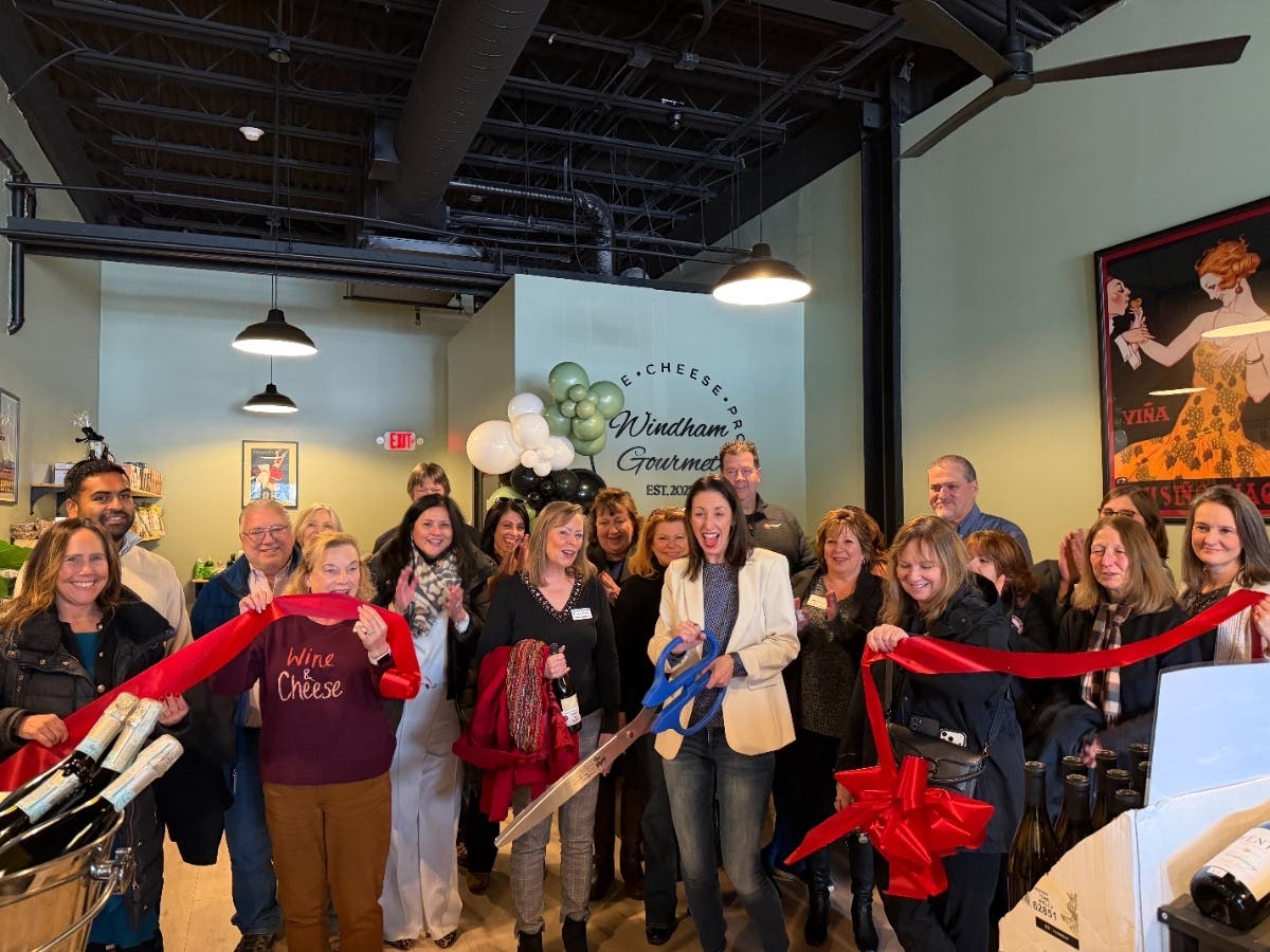 Brooke Calabro, owner of Windham Gourmet, surrounded by Chamber members, friends, and family