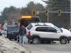 A tow truck clears a crash at the intersection of Sheep Davis Road and Interstate 393 on March 5.