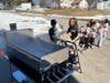 Students assist in boiling the sap they gathered from maple trees.