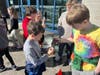 Students taste the maple syrup they created.