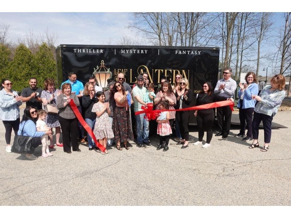 Vanessa Plowman (center) celebrating with family, friends, Chamber members, and employees.