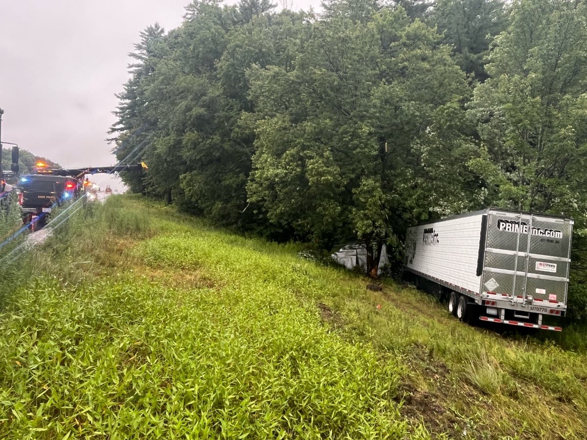A tractor-trailer truck and a van collided on Route 101 in Auburn on July 29, sending both vehicles into the woods.