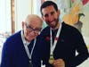 Jason and Papa together after he completed the Big 5 Marathon on an open animal reserve in South Africa. Papa was wearing that medal and insisted Jason wear the Great Wall of China one.
