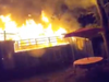 Two people were displaced after a fire destroyed a home and spread to nearby brush late Sunday night in Fairfax.